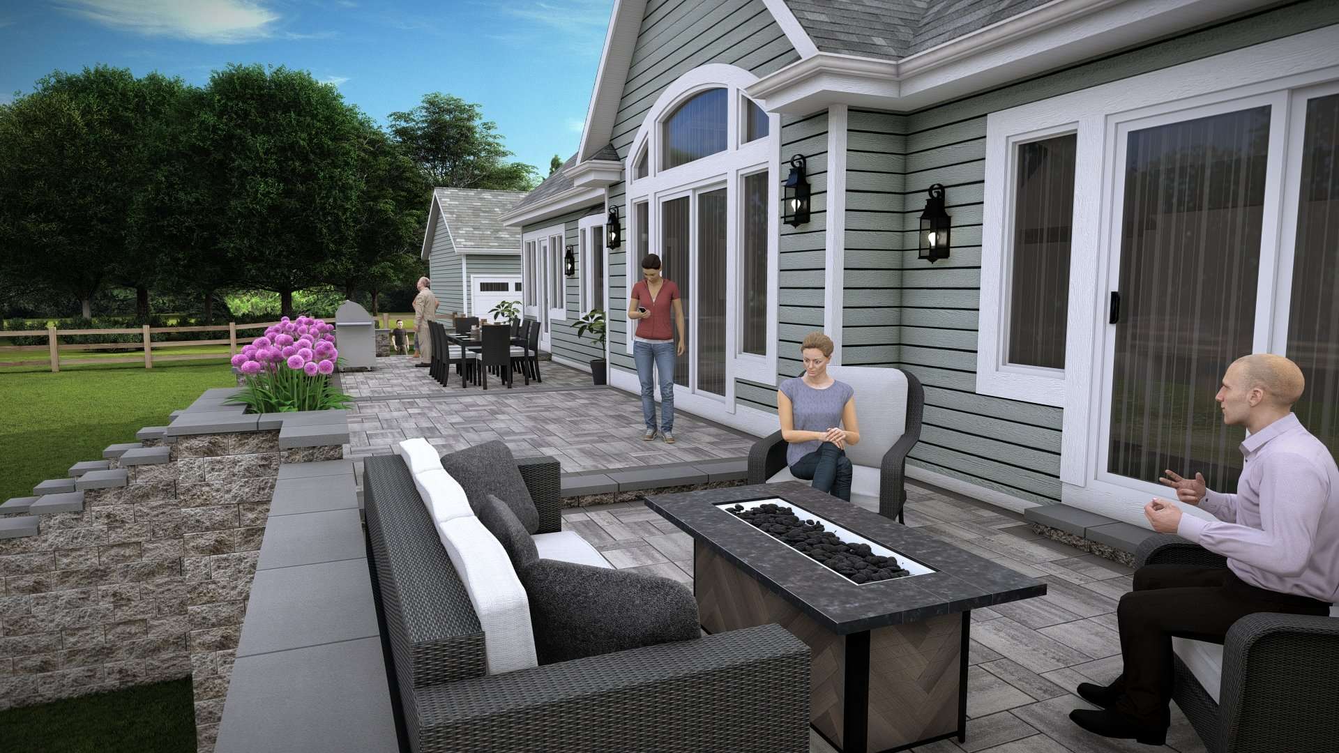 Build Your Dream Outdoor Kitchen Outdoor living space featuring a modern patio with seating, fire table, and dining area, surrounded by lush greenery and flowering plants, illustrating hardscape design by Laughter Family Hardscapes.