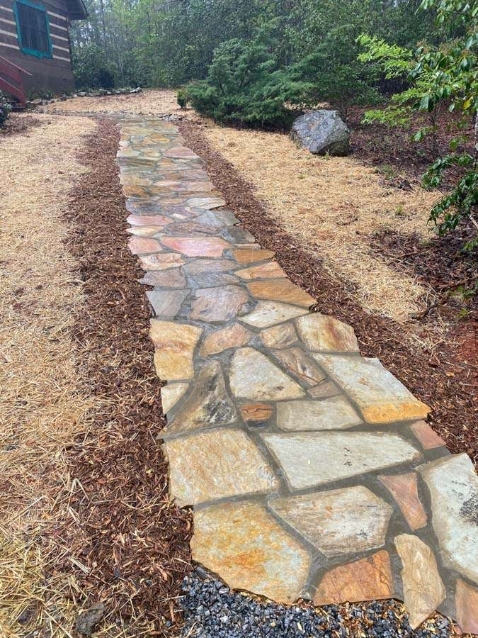 Laughter Family Hardscapes Hardscaping Services Buncombe County NC -08 The image depicts stone pavers that are layout a walking pathway.